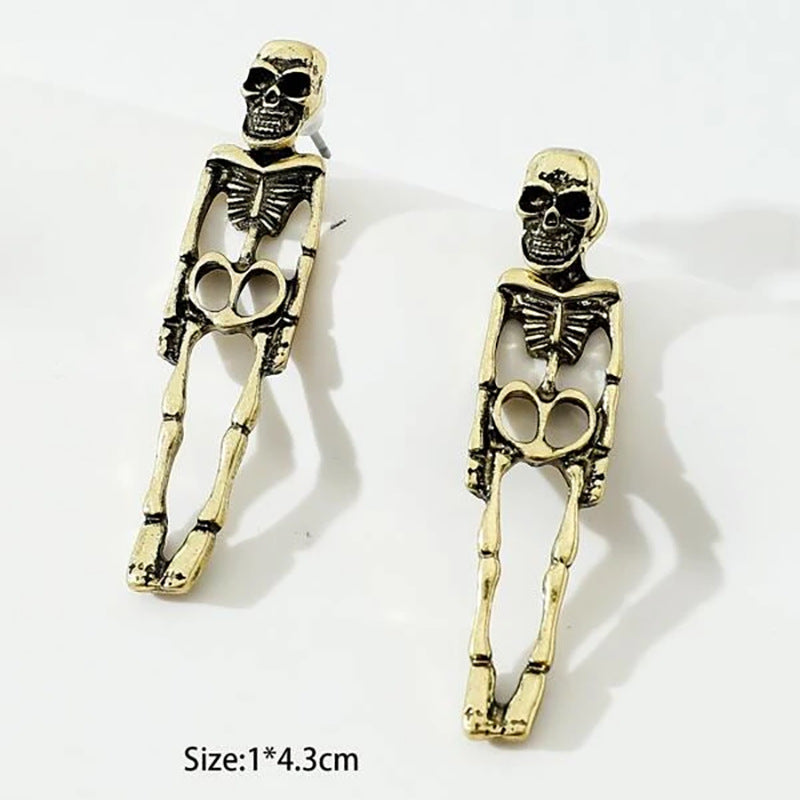 Halloween earrings, skull earrings, skull stud earrings, Halloween jewelry, goth earrings, spooky earrings, gothic jewelry, Halloween costume jewelry, statement earrings, Halloween accessories.