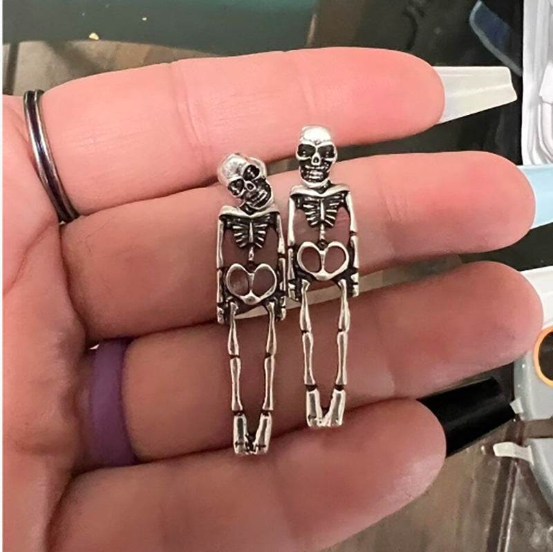 Halloween earrings, skull earrings, skull stud earrings, Halloween jewelry, goth earrings, spooky earrings, gothic jewelry, Halloween costume jewelry, statement earrings, Halloween accessories.