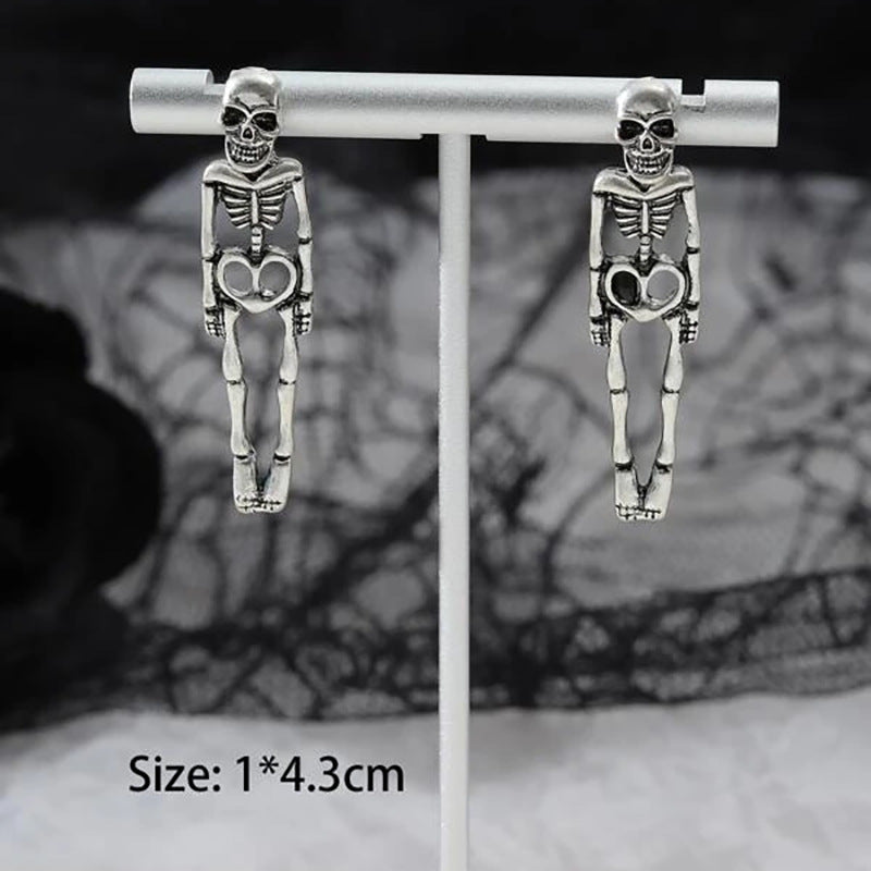 Halloween earrings, skull earrings, skull stud earrings, Halloween jewelry, goth earrings, spooky earrings, gothic jewelry, Halloween costume jewelry, statement earrings, Halloween accessories.